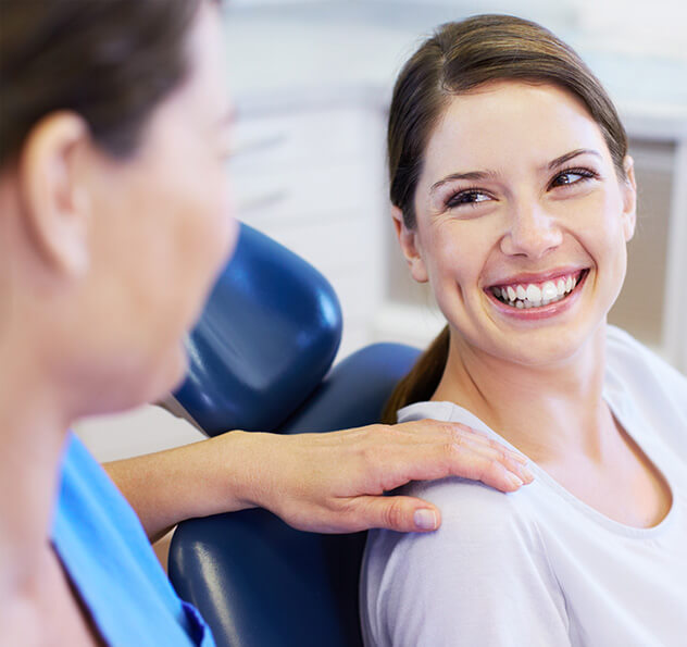 smiling woman sitting in a dental chair