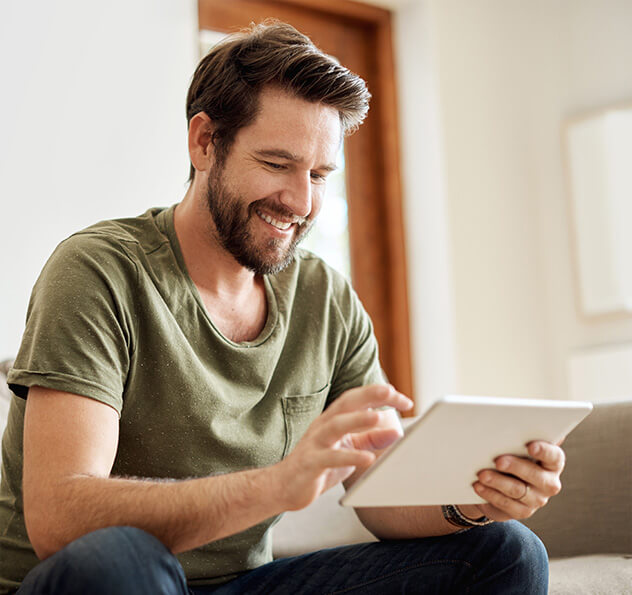 man looking at his tablet computer