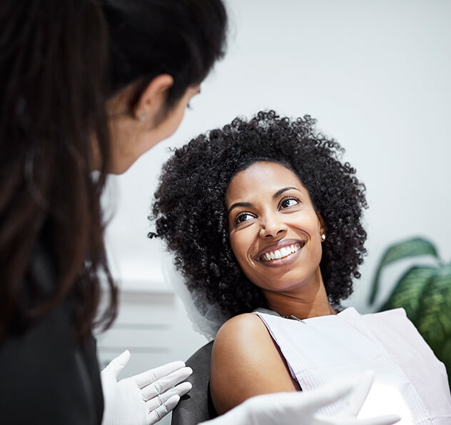 smiling woman sitting in a dental chair