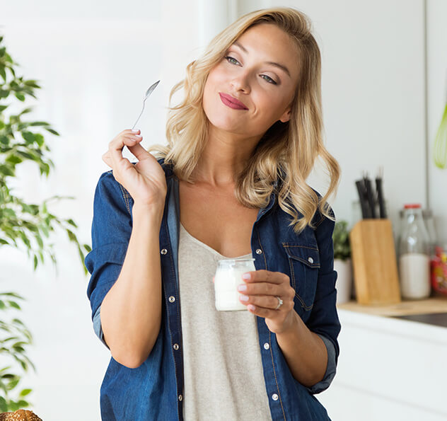 woman eating yogurt