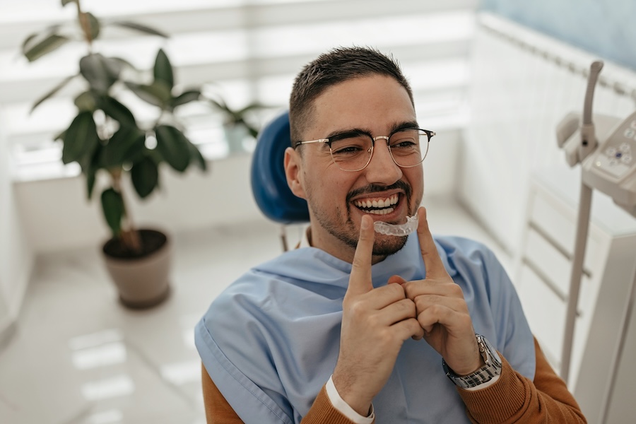 man in dental office starting invisalign treatment