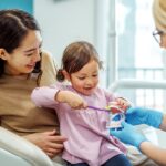mother with child at a first dental appointment