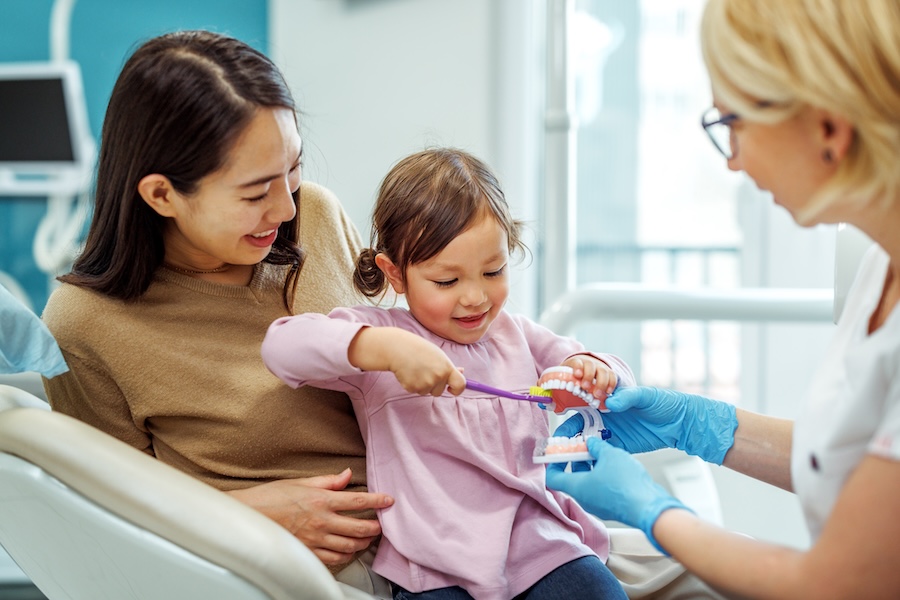 mother with child at a first dental appointment