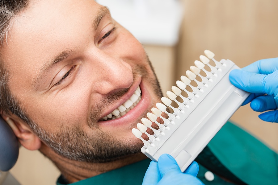 man considering dental veneers, porcelain veneers